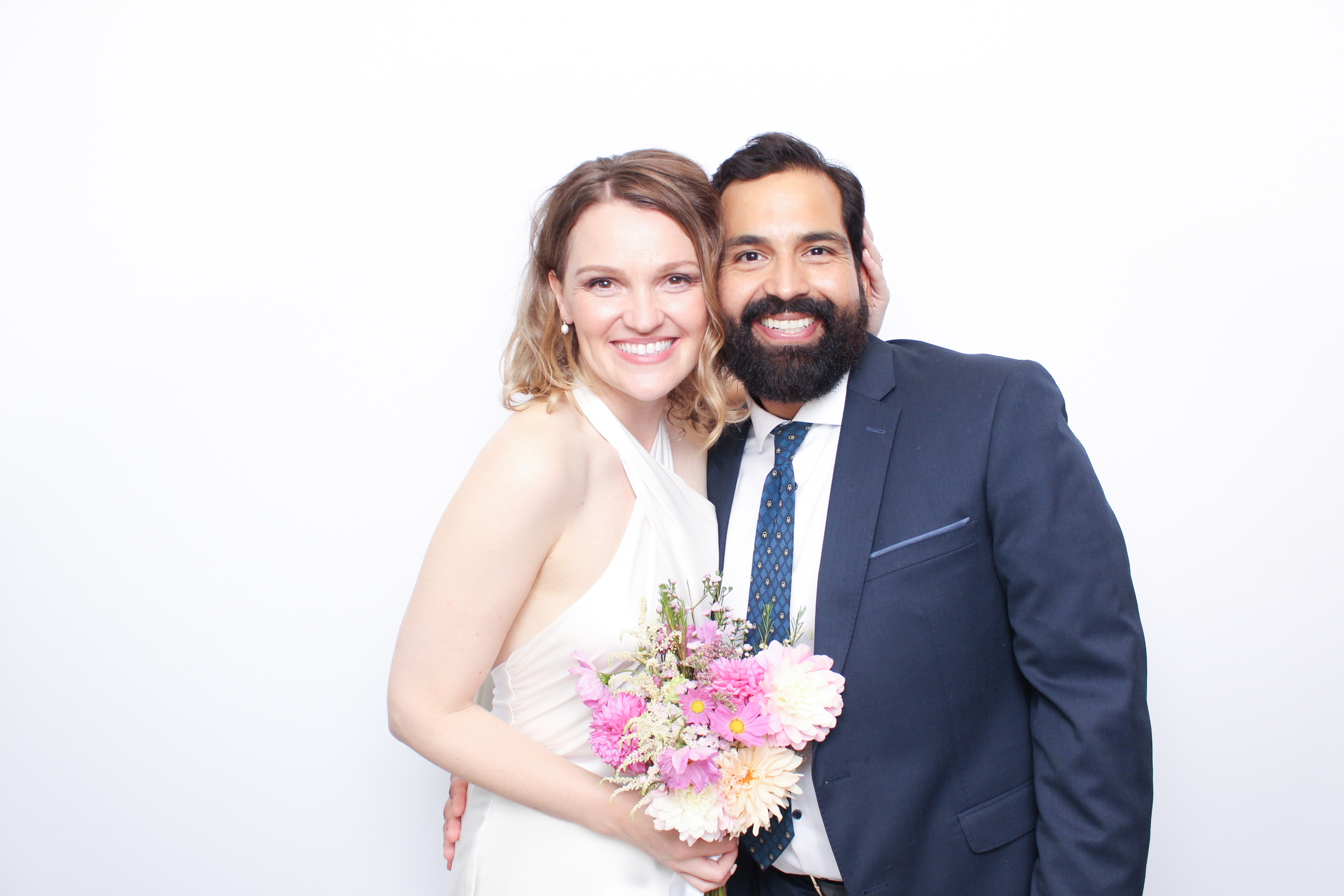 Bride and groom at wedding photo booth